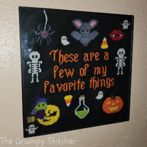 halloween favorite things pattern by the grumpy stitcher completed and framed